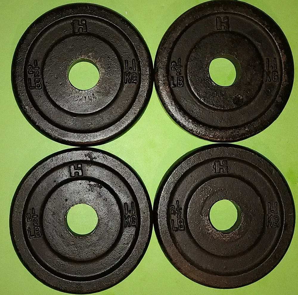Set of Four Vintage Cast Iron 2 1/2 lb Barbell Dumbbell Weight Plates