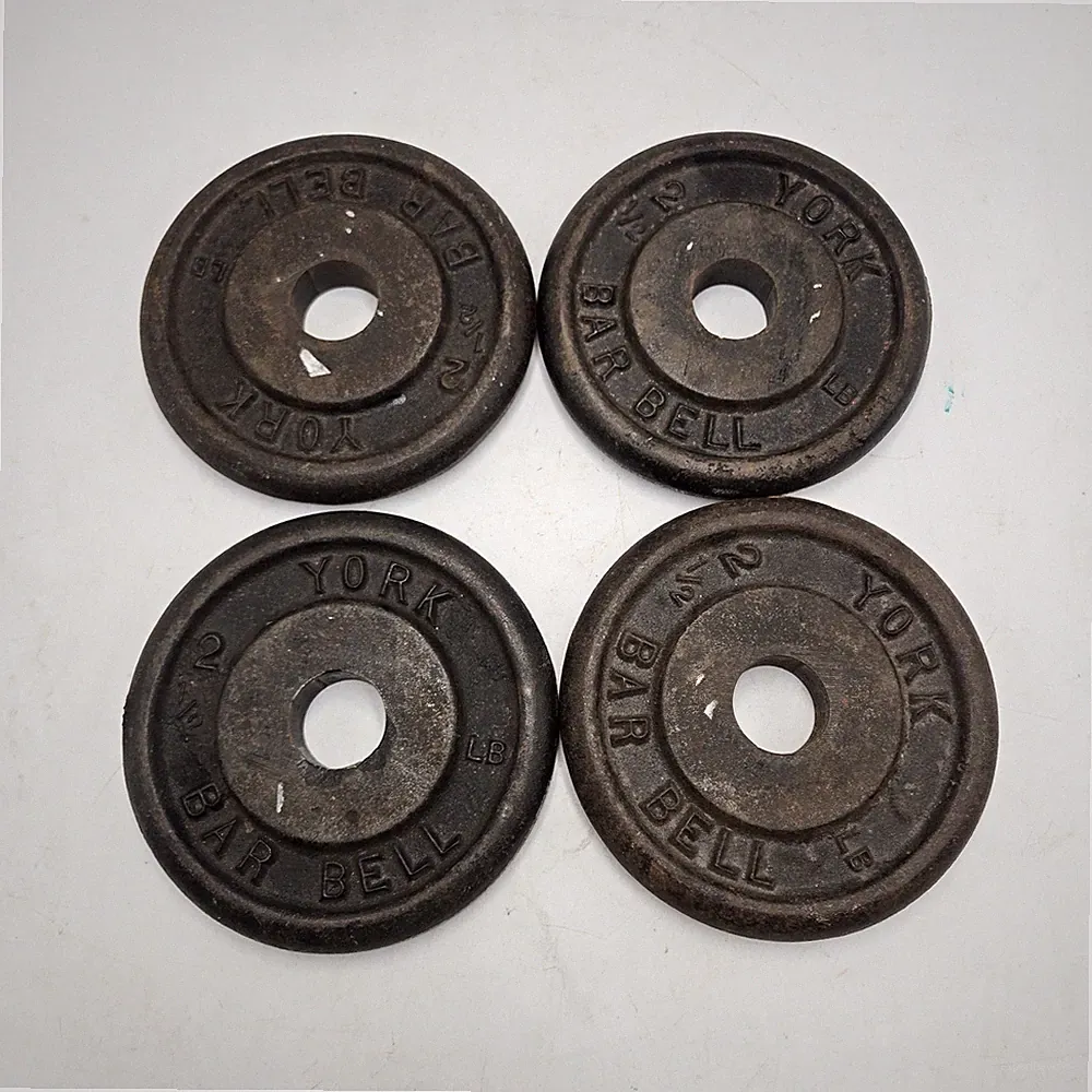 Set of Four York 2 1/2 lb Cast Iron Barbell / Dumbbell Weight Plates